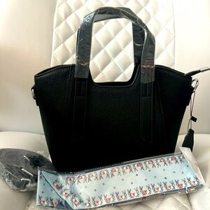 Black pebbled leather purse NWT. Silver hardware long adjustable strap scarf bow